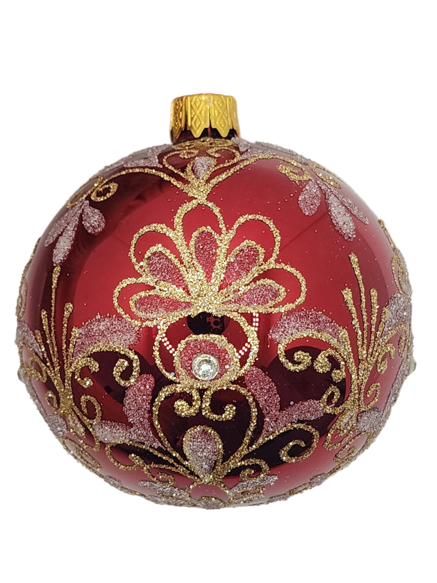 Decorative red ornament with gold and silver floral patterns.