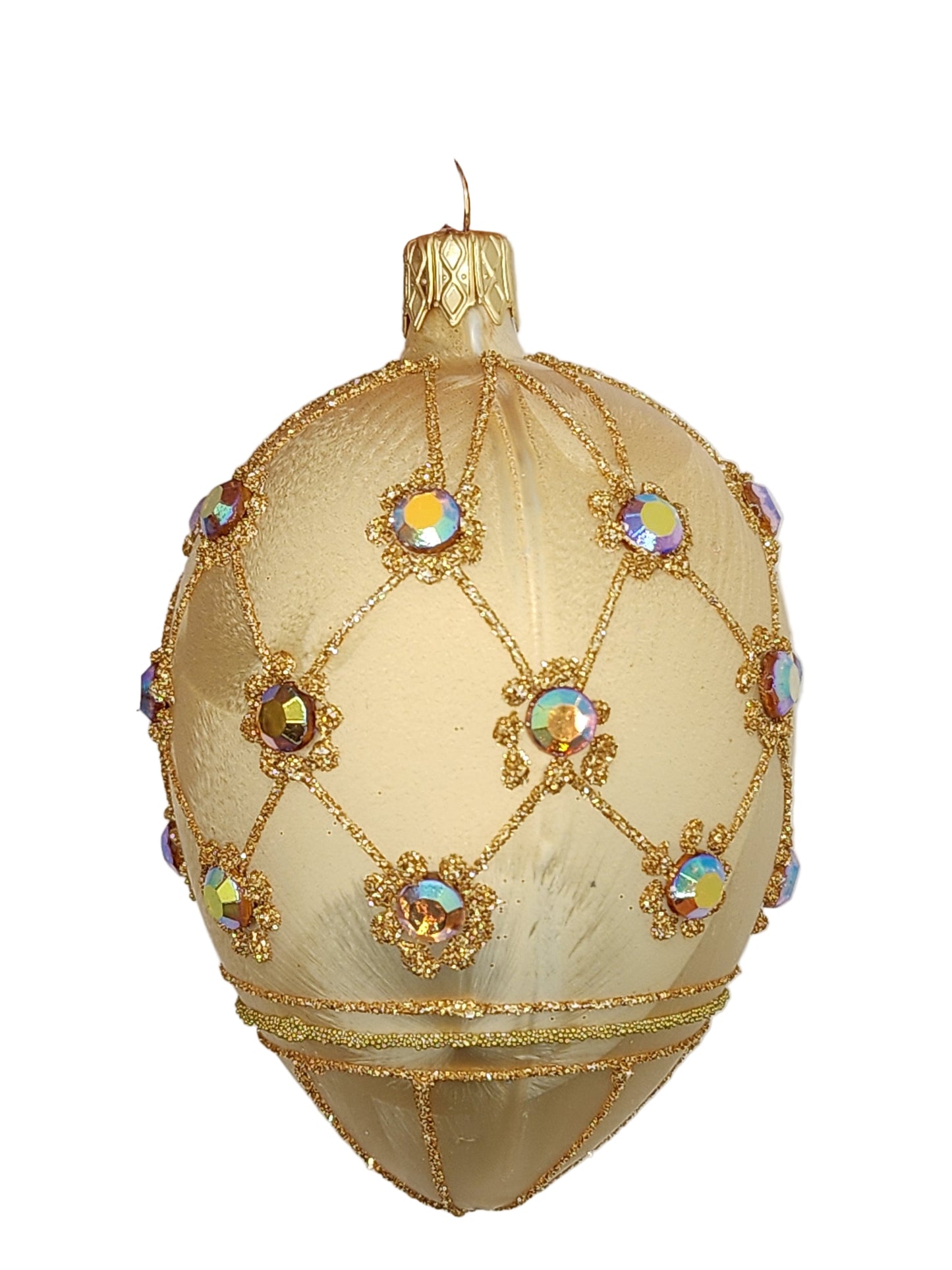 Decorative egg with gold embroidery and colorful stones on a white background