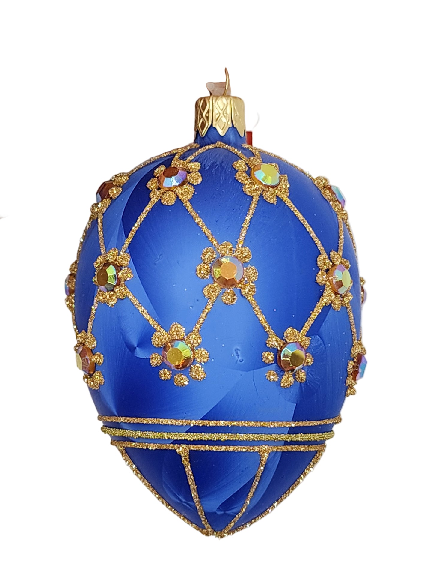 Decorative blue egg with gold embellishments against a white background