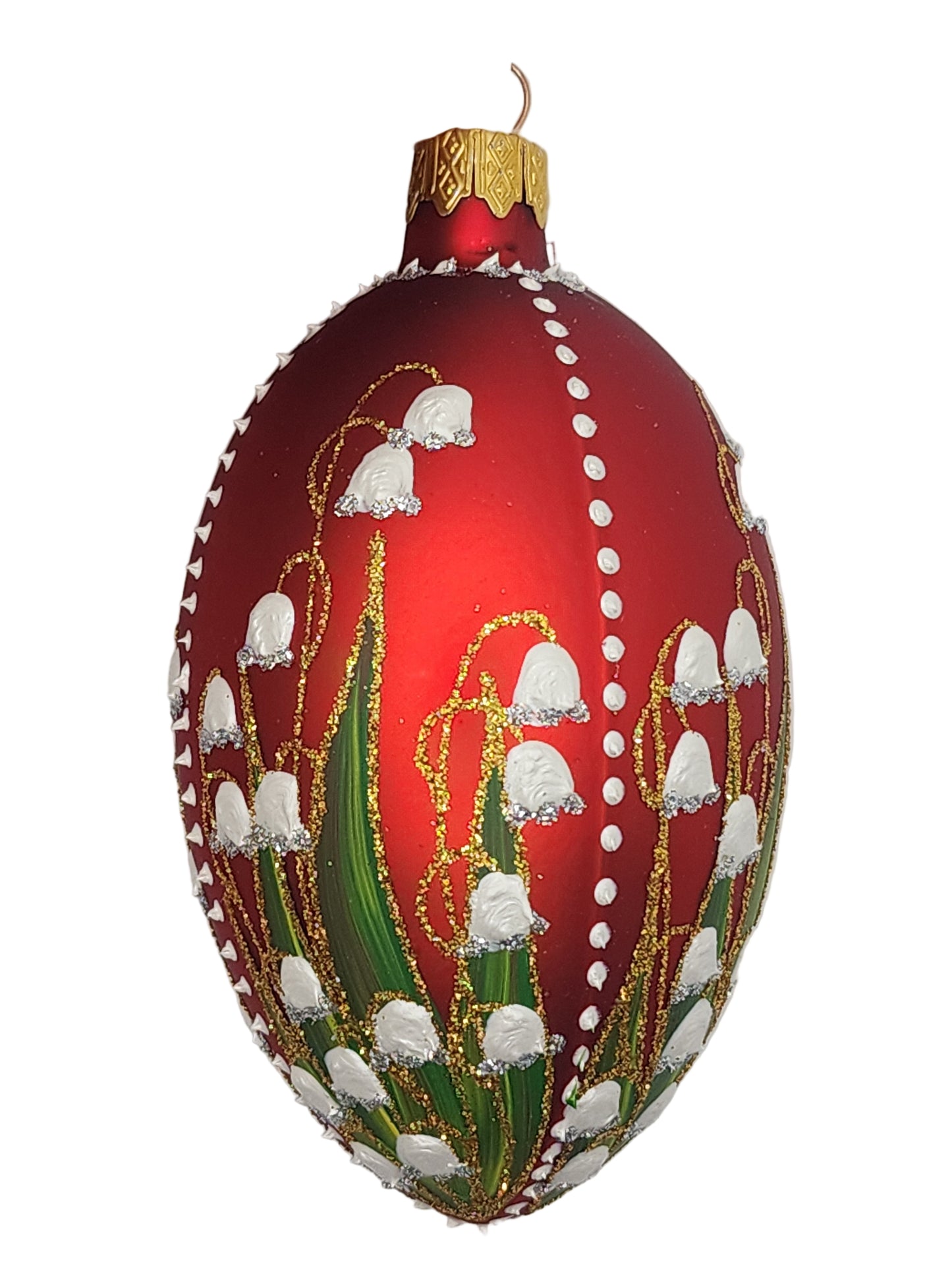 Decorative Christmas ornament with red base and festive design on a white background