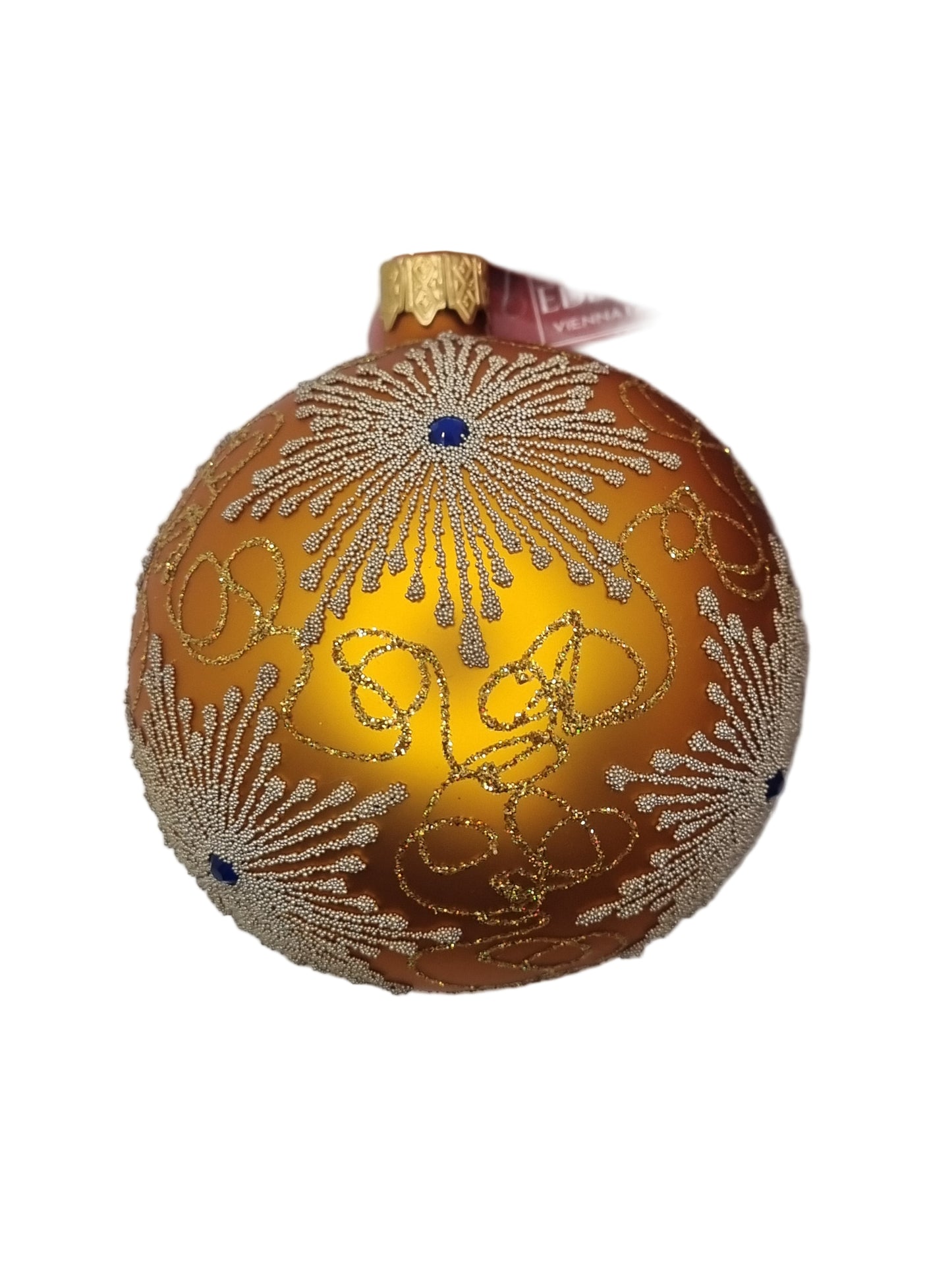 Decorative gold ornament with intricate patterns on a white background