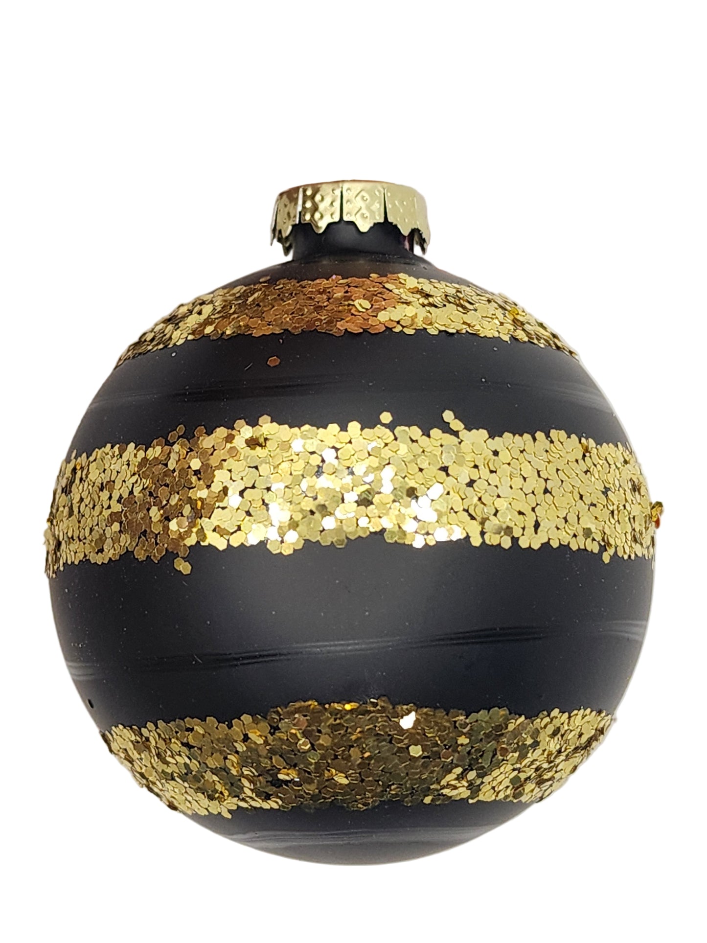 Black ornament with gold sequins against a white background
