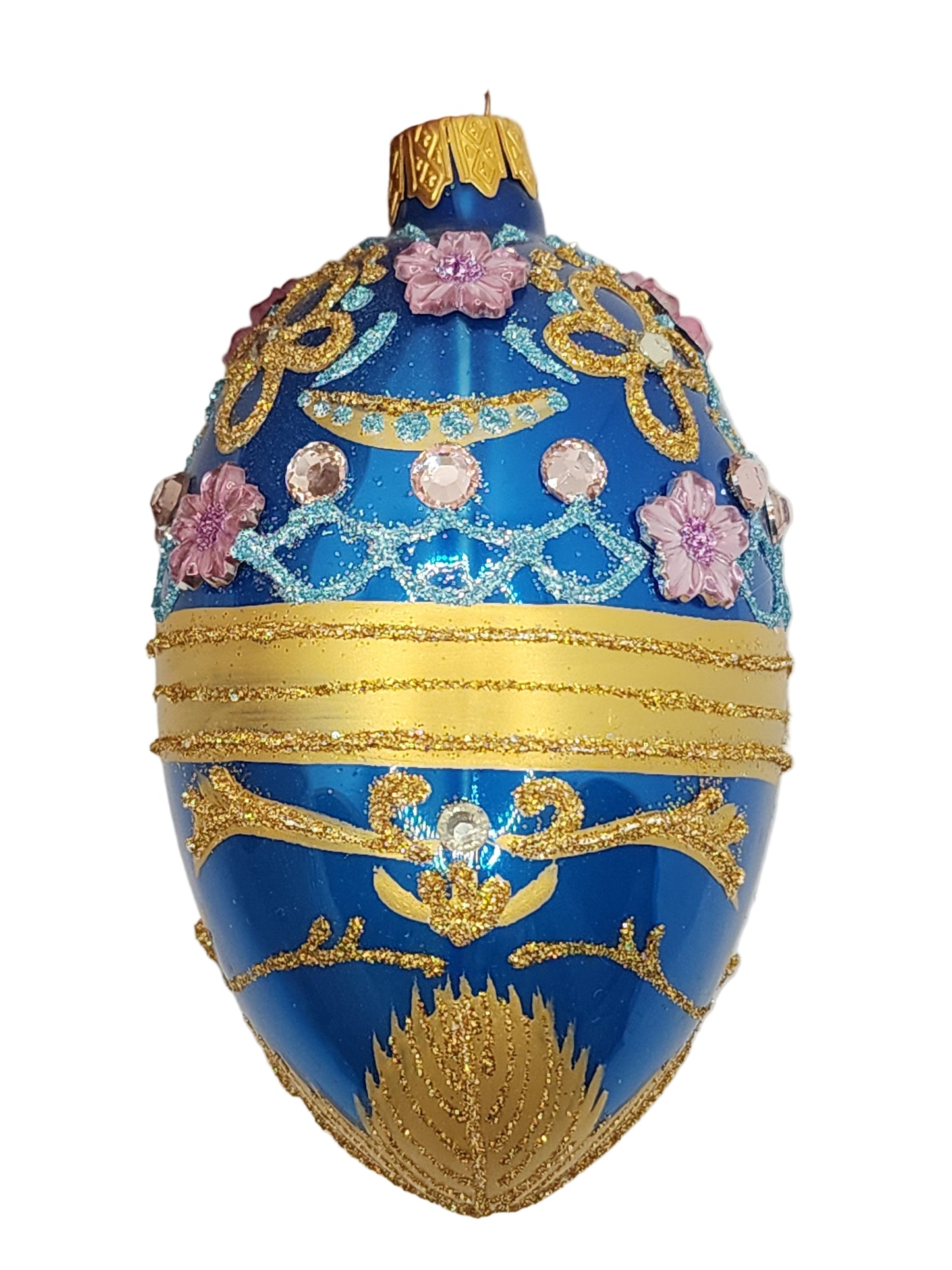 Decorative blue egg with gold and pink embellishments on a white background