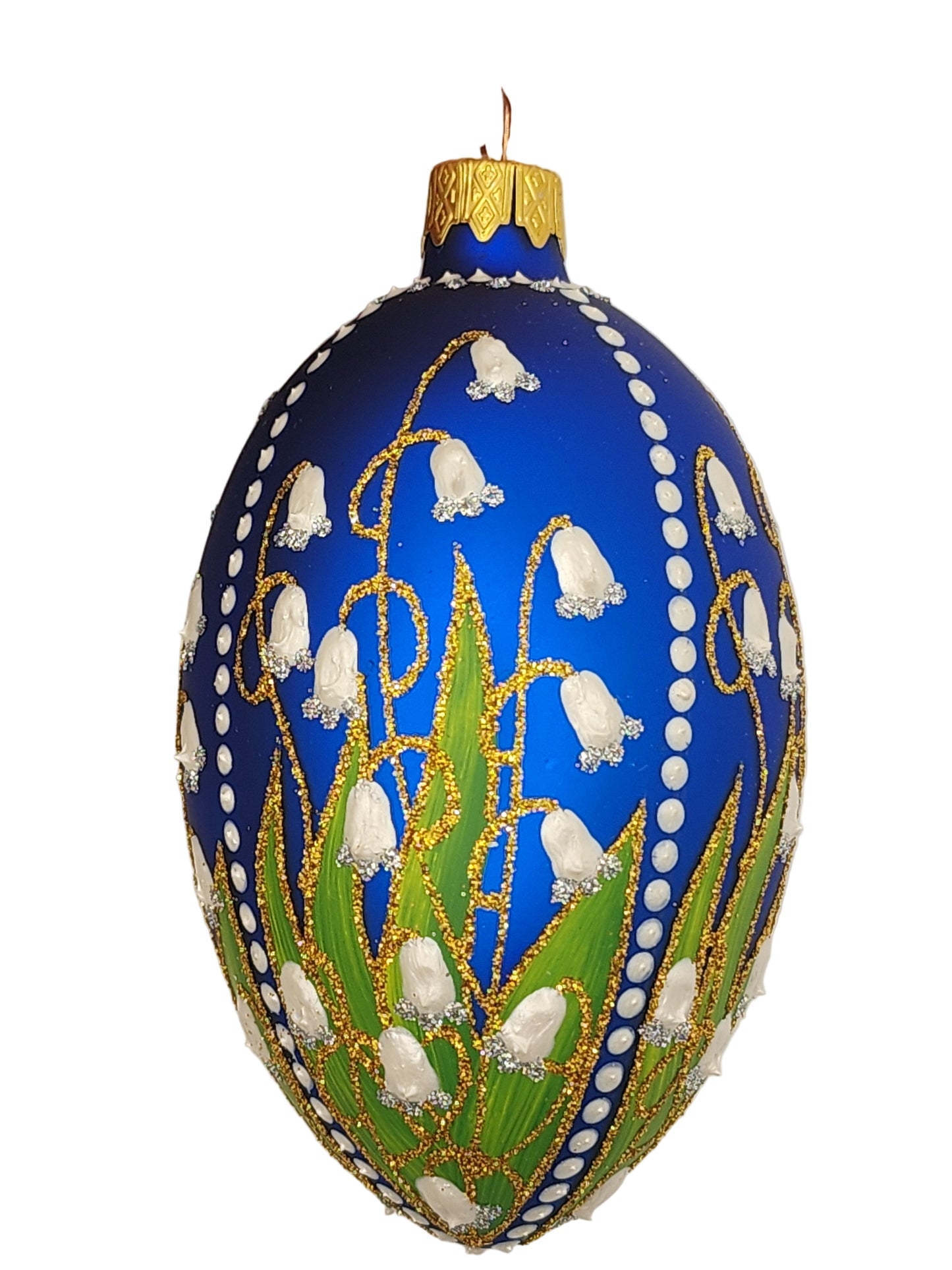 Decorative egg with blue, green, and gold colors against a white background