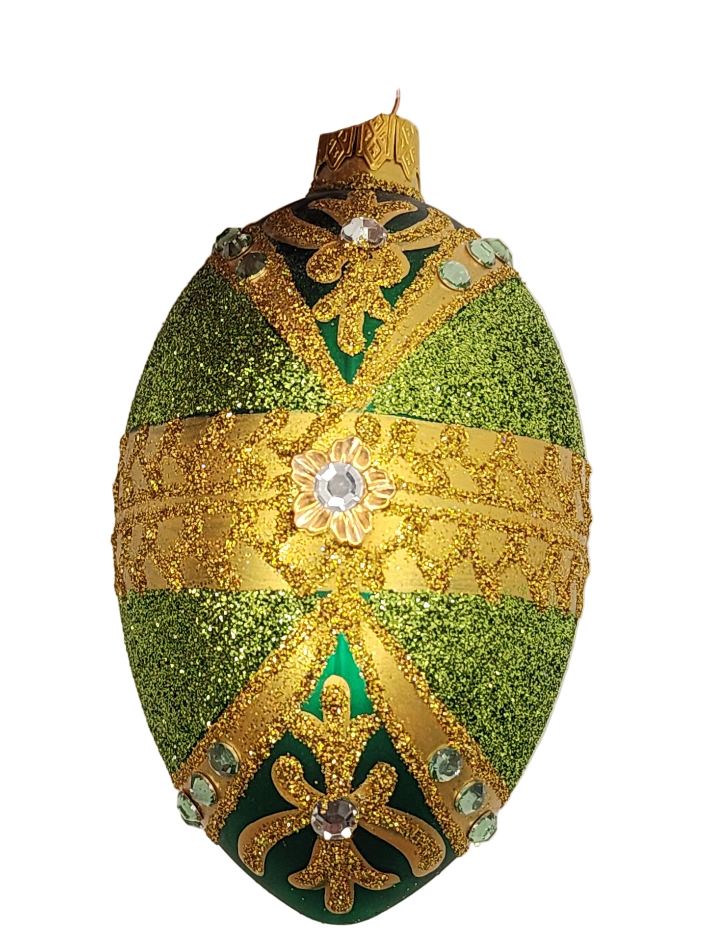 Decorative green and gold egg on a light background