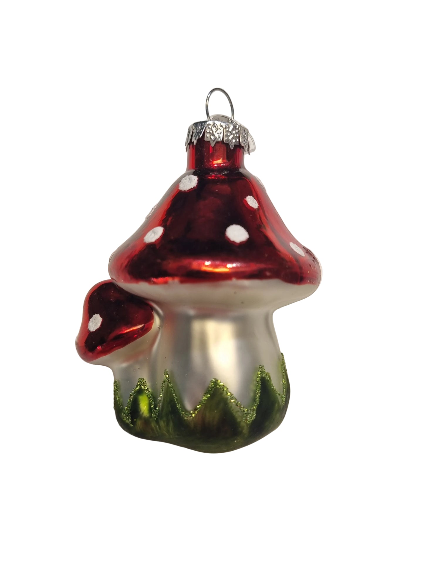 Glass Christmas ornament with two red and white mushrooms on a white background.
