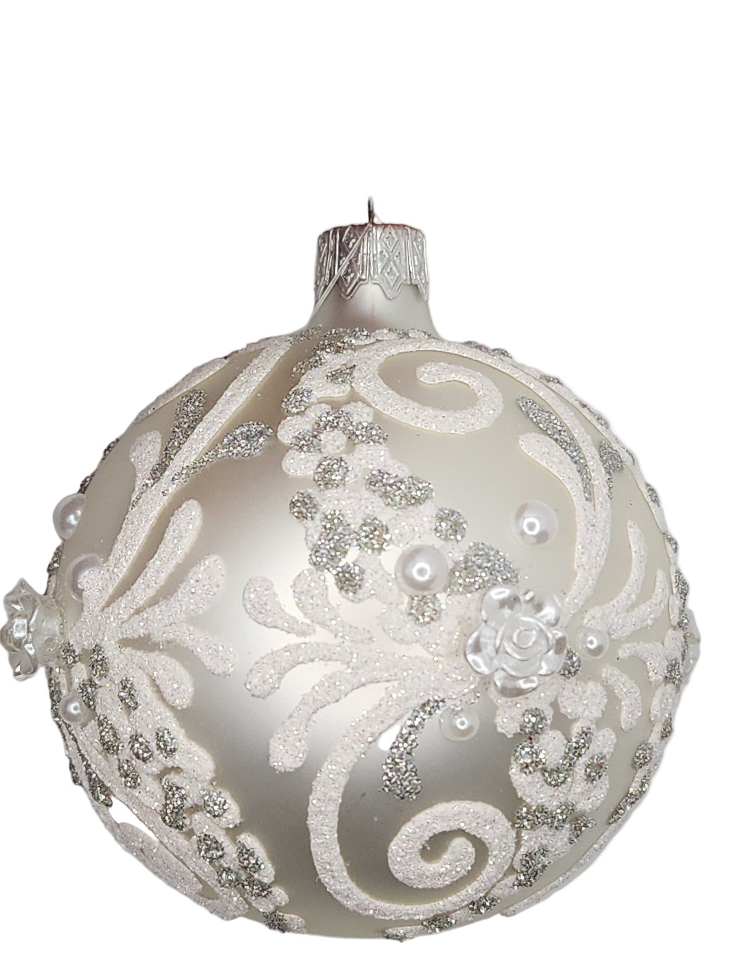 Decorative Christmas ornament with intricate patterns against a neutral background