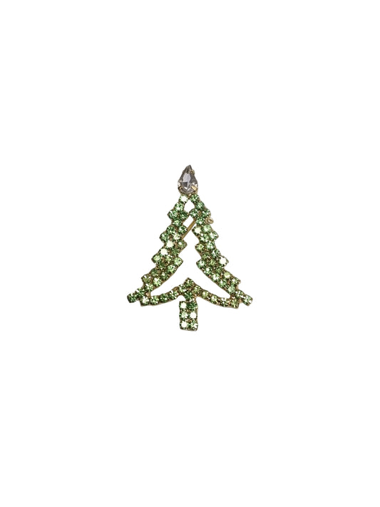 Decorative green bow with rhinestones on a gray background