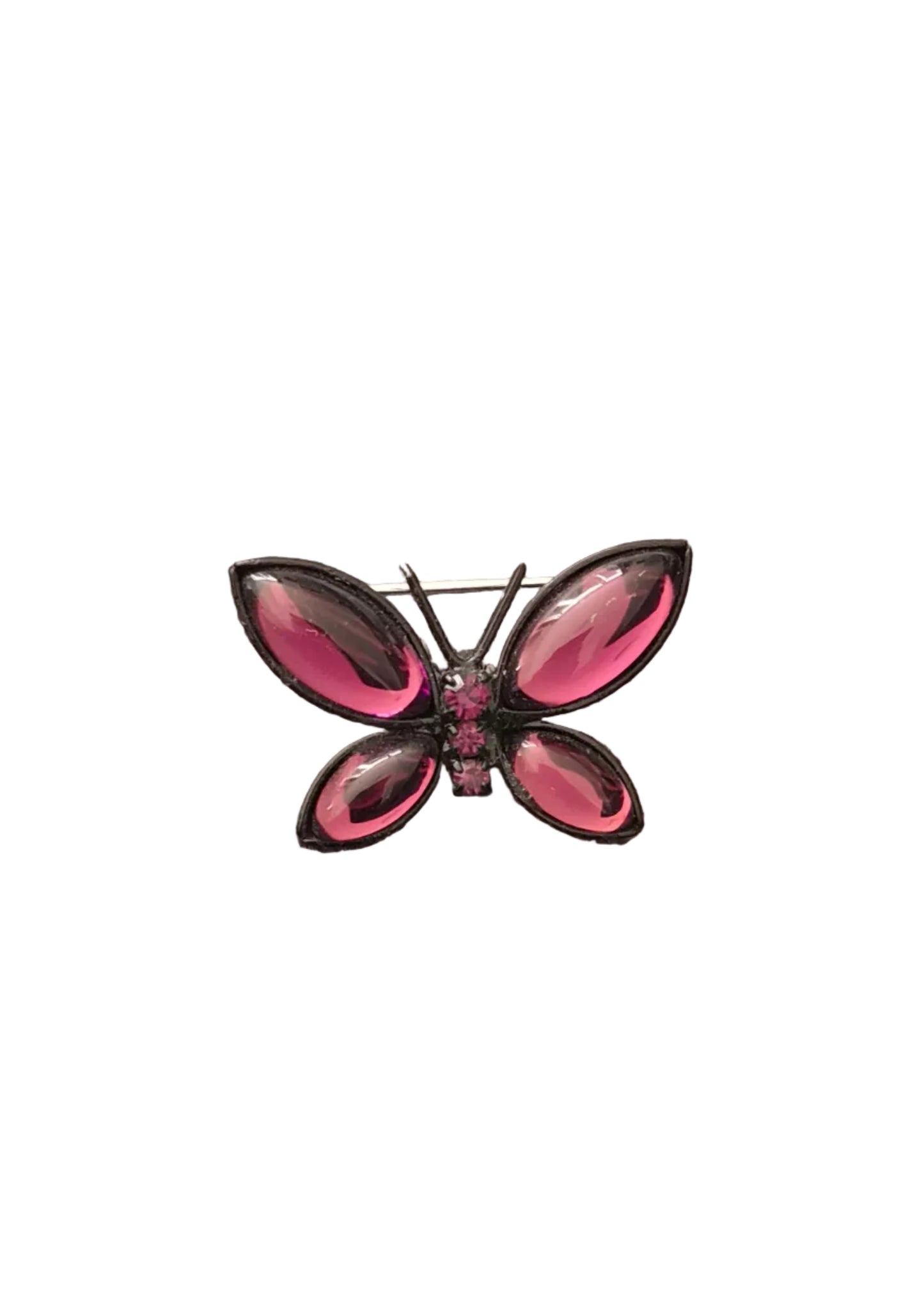 A butterfly-shaped brooch with glossy pink rhinestone wings and a black metal frame.