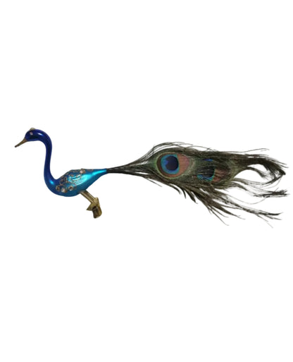 Blue glass peacock ornament with a feather