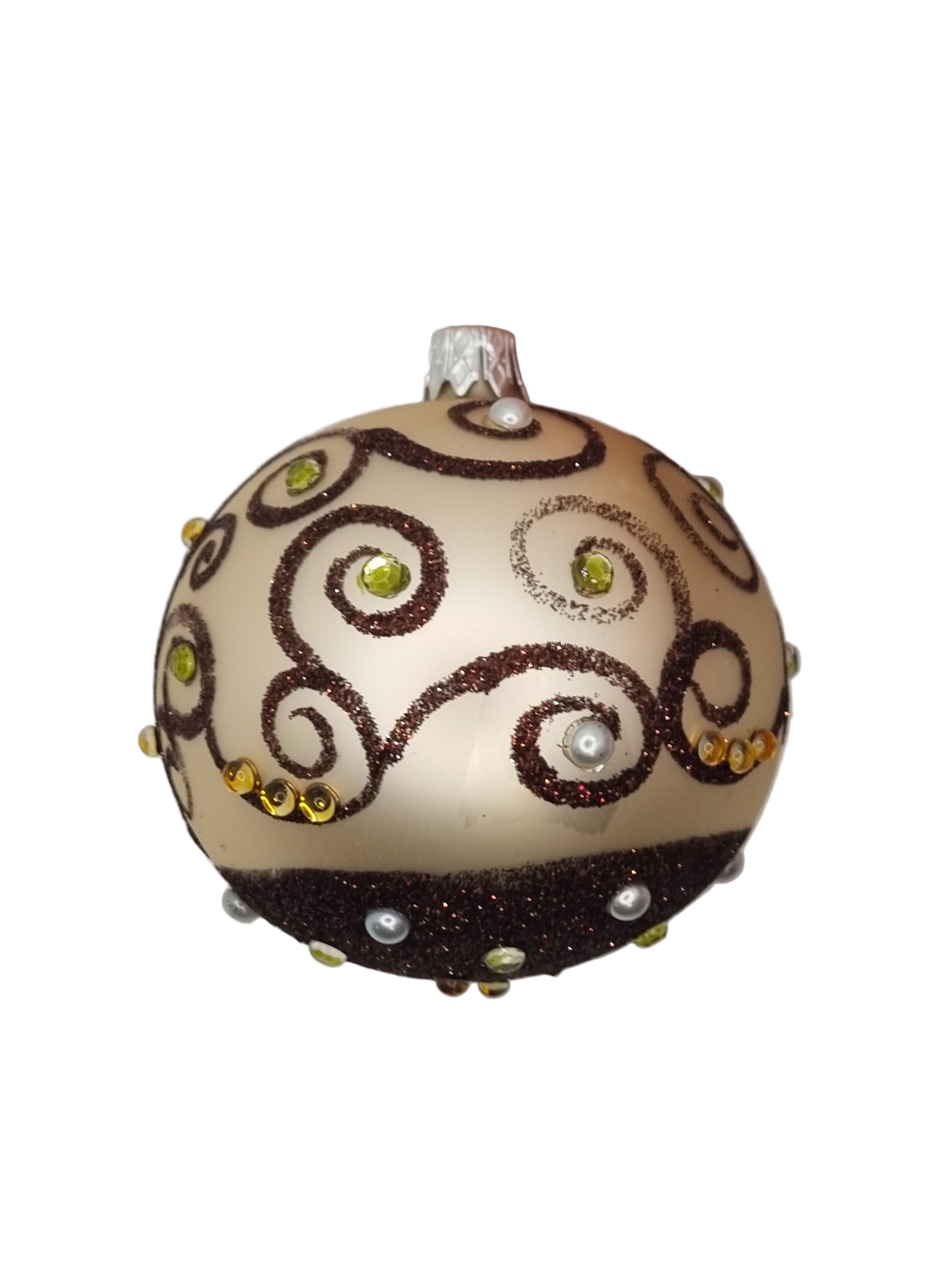 Decorative ornament with brown swirl patterns and small stones on a light background