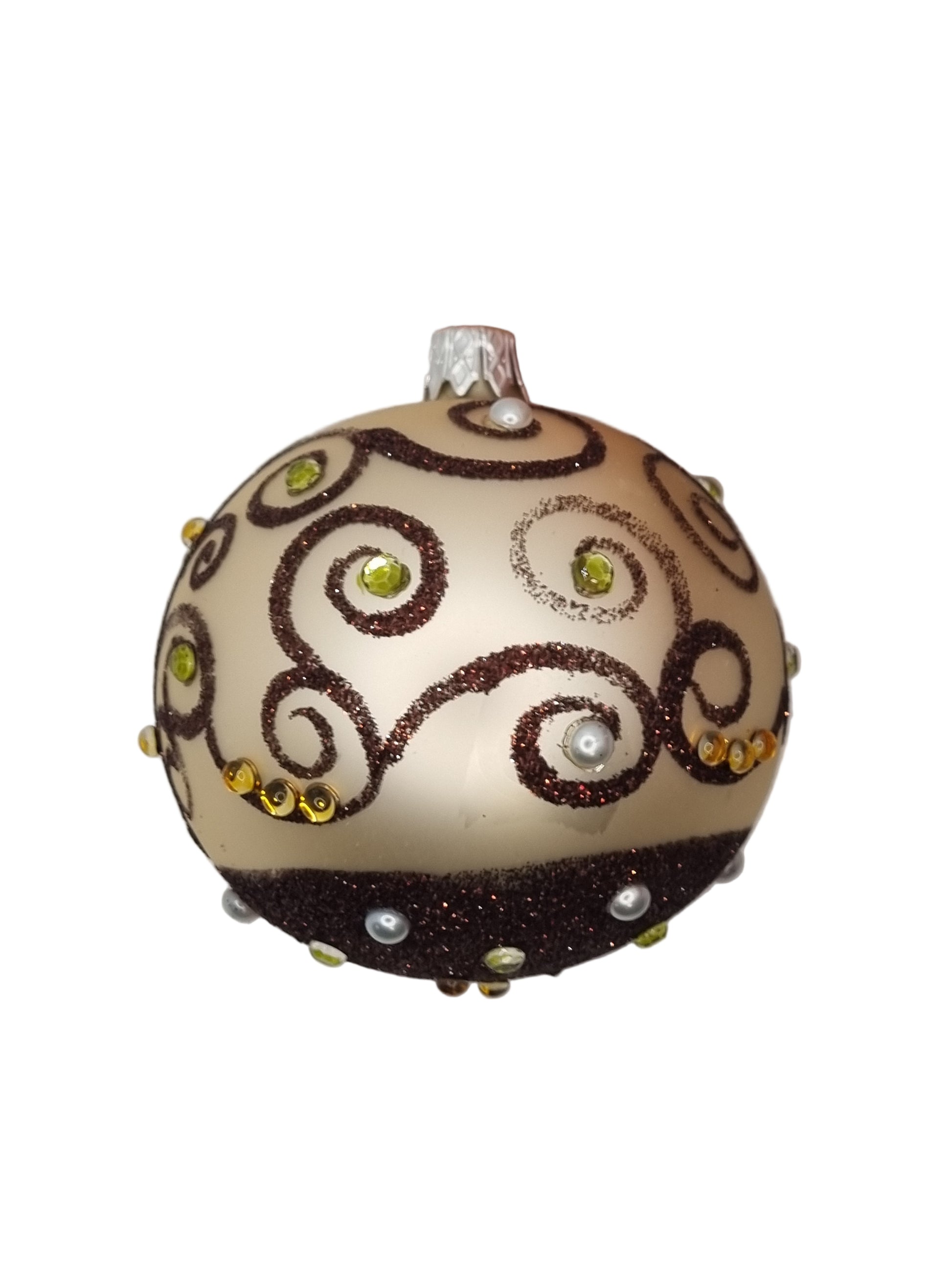 Decorative ornament with brown swirl patterns and small stones on a light background