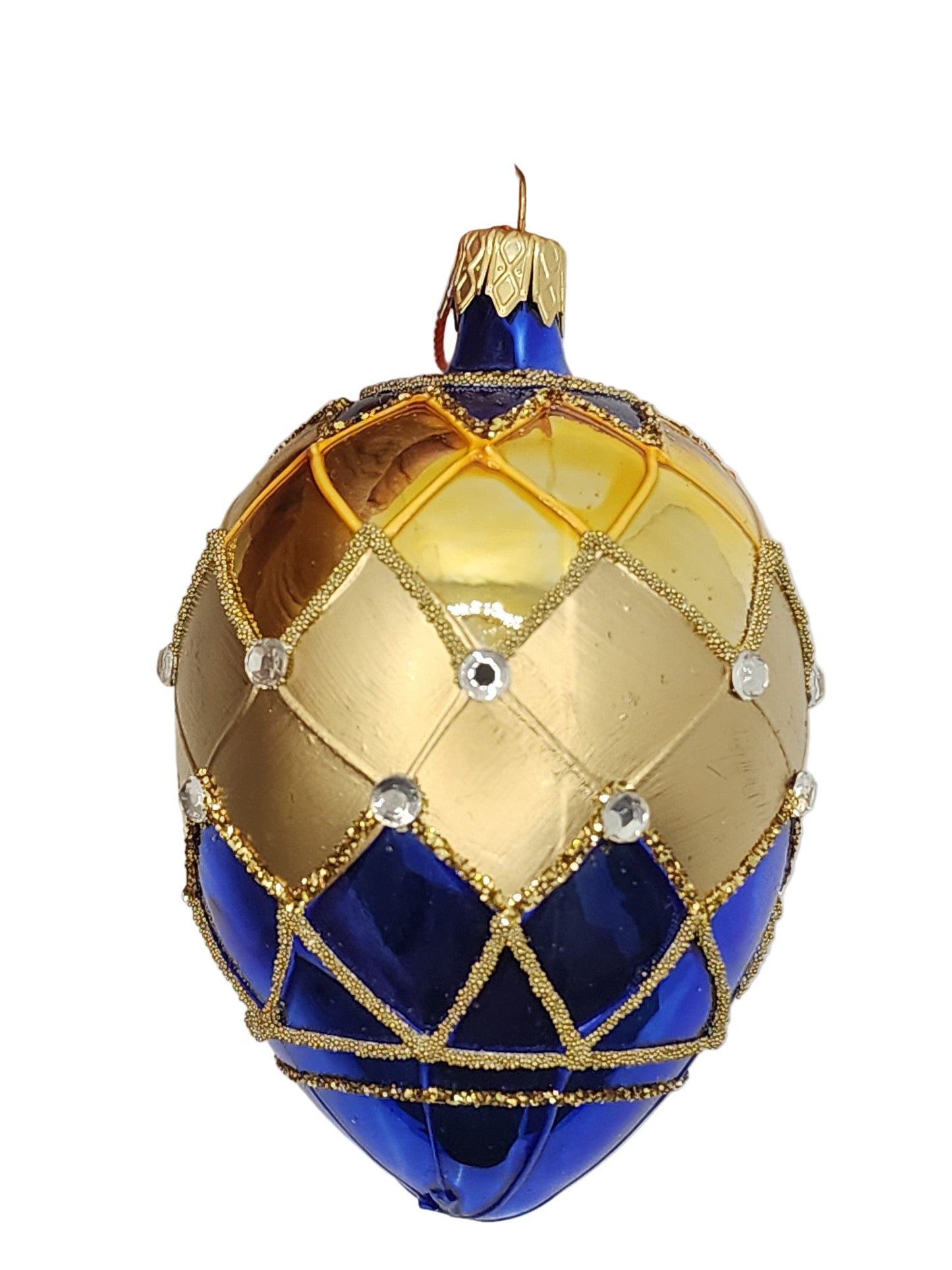 Decorative egg with blue and gold pattern against a white background