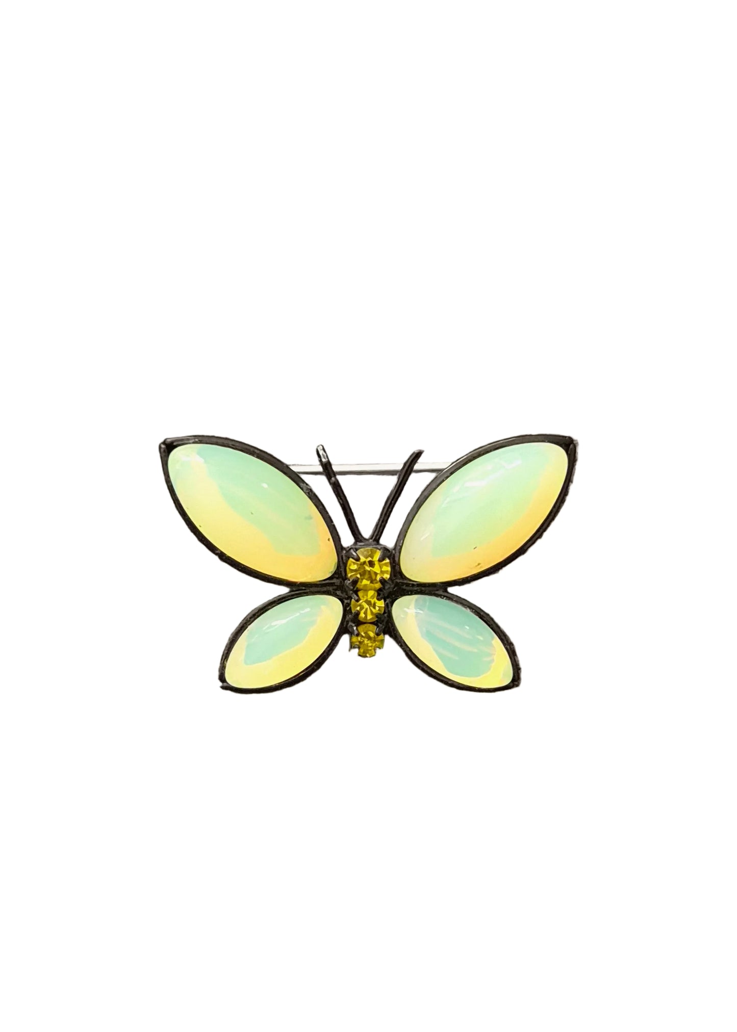 A butterfly-shaped brooch with iridescent pale green and yellow wings, set in silver-toned metal with a small yellow center