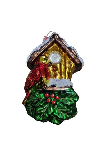 Decorative Christmas ornament of a birdhouse with a bird