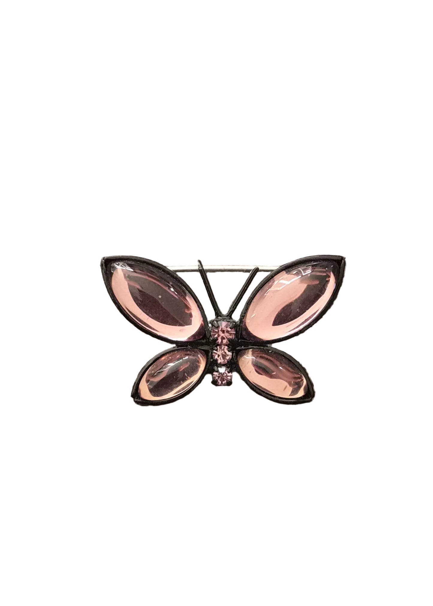 A butterfly-shaped brooch with large marquise-cut pink gemstones and small pink rhinestone accents.